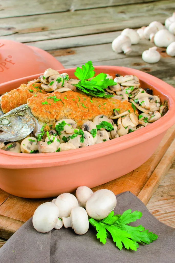 Gratinierte Forellen auf Champignons in Weißwein